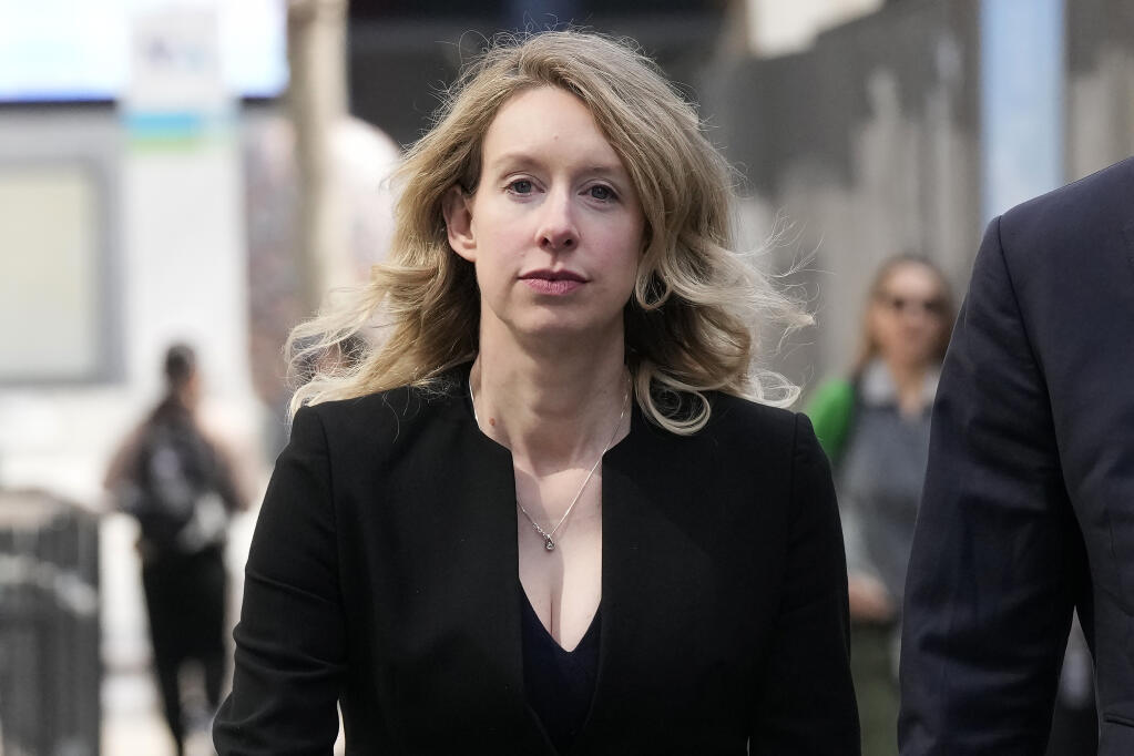 Former Theranos CEO Elizabeth Holmes leaves federal court in San Jose, Calif., Friday, March 17, 2023. (AP Photo/Jeff Chiu)