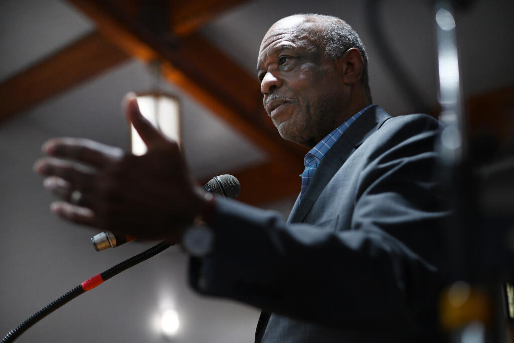 John Jackson, 76, originally from Jackson, Tennessee, who can trace his family lineage to sharecroppers and enslaved people, is pastor for Greater Powerhouse Church of God in Christ in Santa Rosa. He stands at the church’s pulpit Feb. 20, 2023. (Erik Castro / For The Press Democrat)