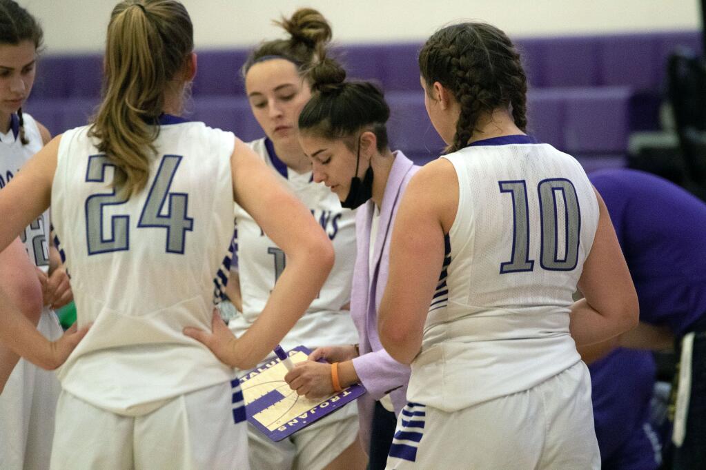 Petaluma coach Sophie Bihn draws up a play for the Trojans in their game against Sonoma Valley. (DWIGHT SUGIOGA FOR THE ARGUS-COURIER)
