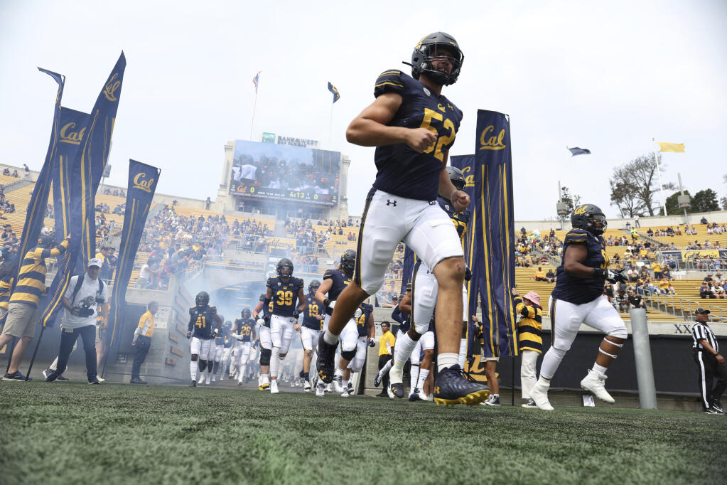 Cal linebacker Braxten Croteau enters the field before Saturday’s game against UNLV in Berkeley. (Jed Jacobsohn / ASSOCIATED PRESS)