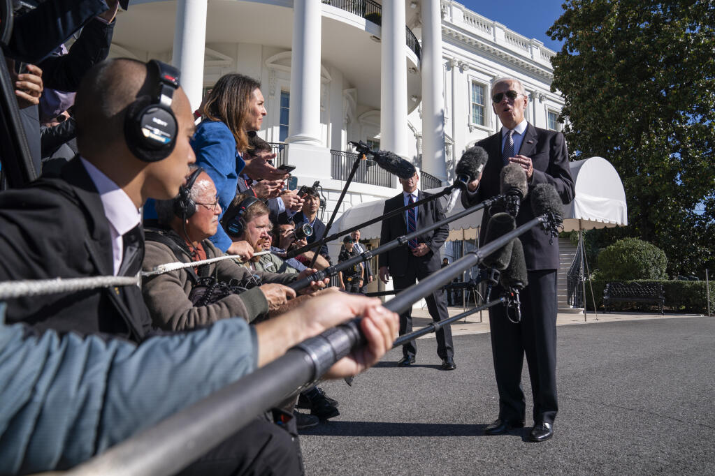 President Joe Biden talks to reporters before boarding Marine One on the South Lawn of the White House, Thursday, Oct. 6, 2022, in Washington. (AP Photo/Evan Vucci)