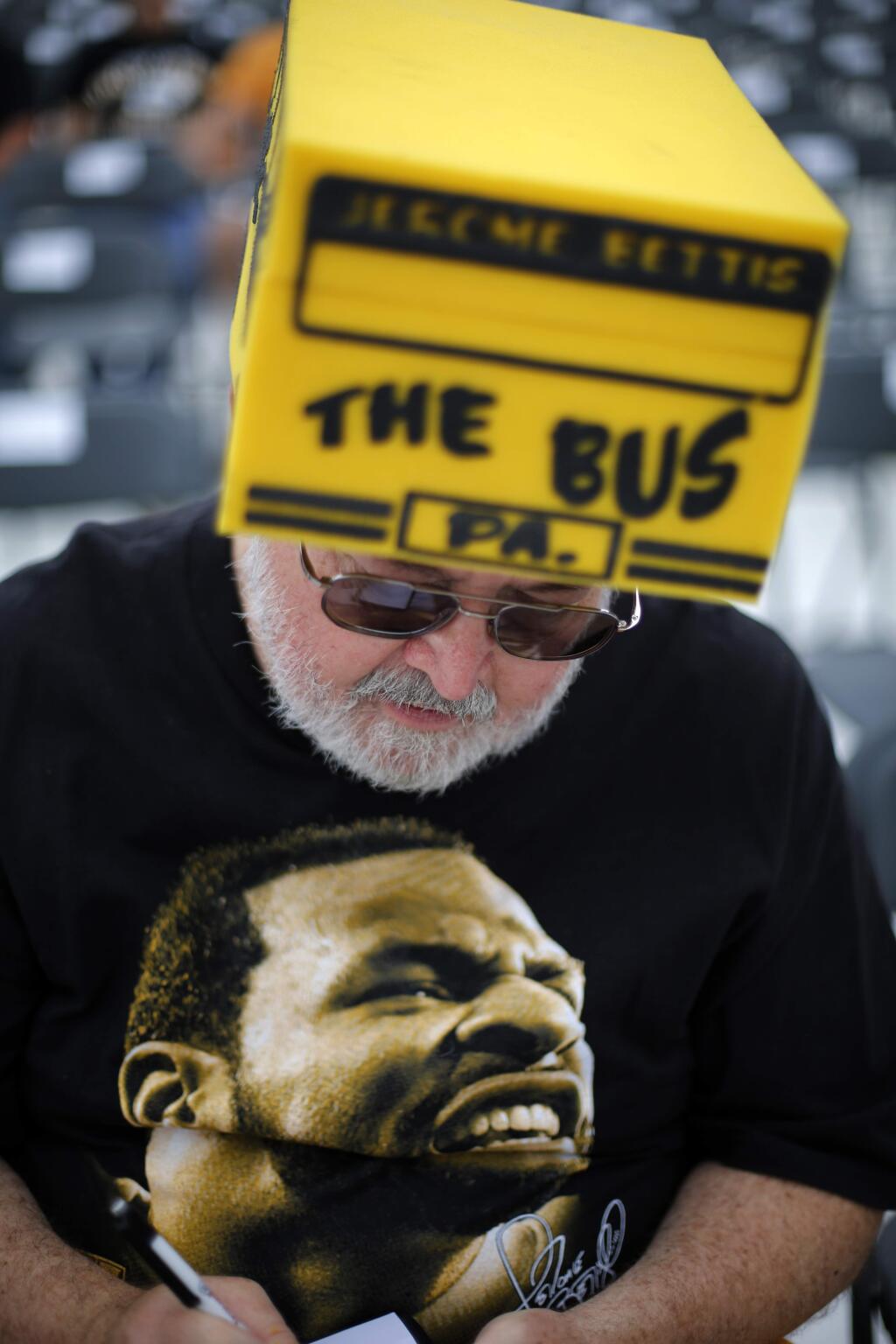 Jerome Bettis fan Marty Higbee, of Cincinnati, wears a foam Bus as he waits for the induction into the Pro Football Hall of Fame of Pittsburgh Steelers running back Jerome Bettis at Tom Benson Hall of Fame Stadium, Saturday, Aug. 8, 2015, in Canton, Ohio. (AP Photo/Gene J. Puskar)