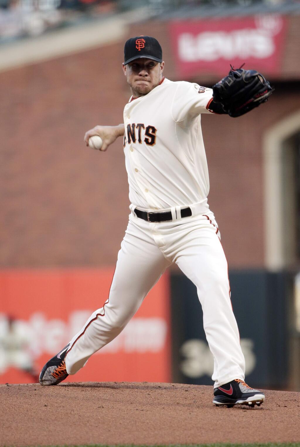 San Francisco Giants starting pitcher Jake Peavy throws to the Colorado Rockies during the first inning of a baseball game Monday, Aug. 25, 2014, in San Francisco. (AP Photo/Marcio Jose Sanchez)
