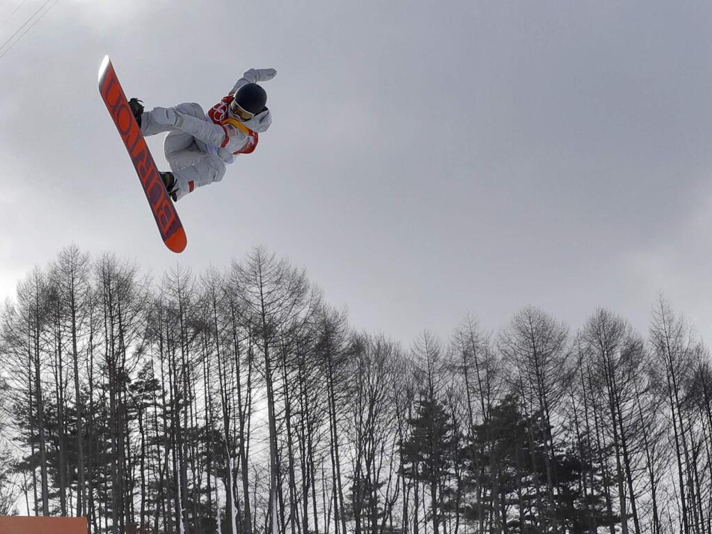 Kelly Clark, of the United States, jumps during the women's halfpipe qualifying at Phoenix Snow Park at the 2018 Winter Olympics in Pyeongchang, South Korea, Monday, Feb. 12, 2018. (AP Photo/Kin Cheung)