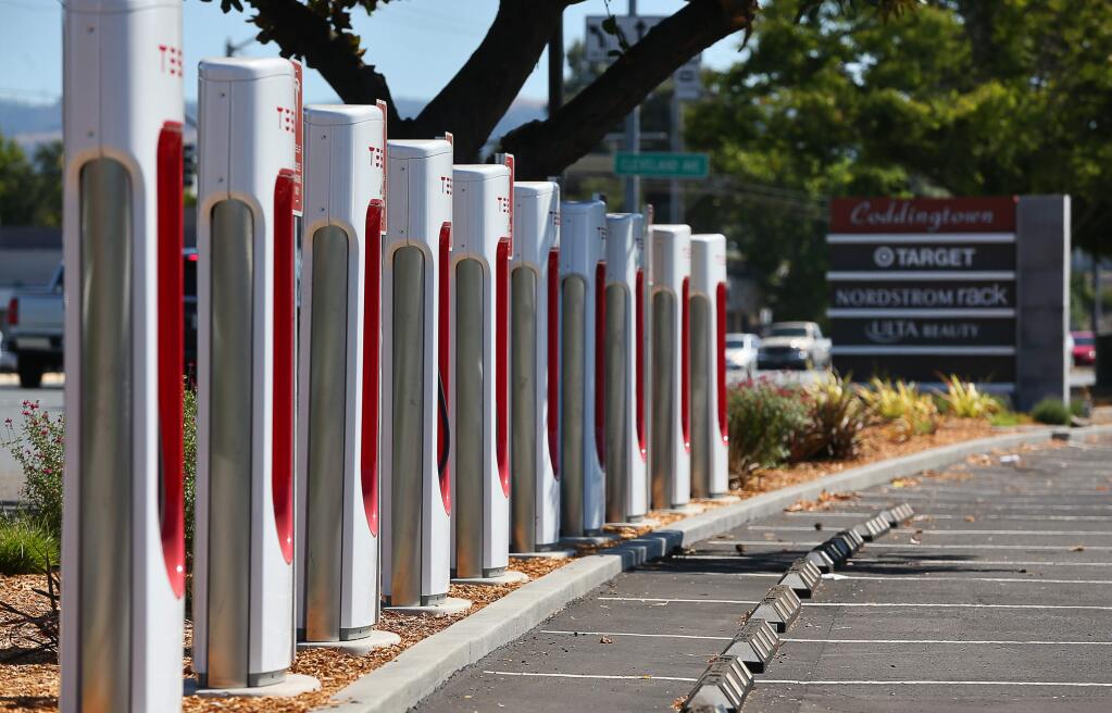Tesla electric vehicle charging stations have been installed at along the north end of the Coddingtown Mall parking lot, near Guerneville Road, in Santa Rosa.(Christopher Chung/ The Press Democrat)