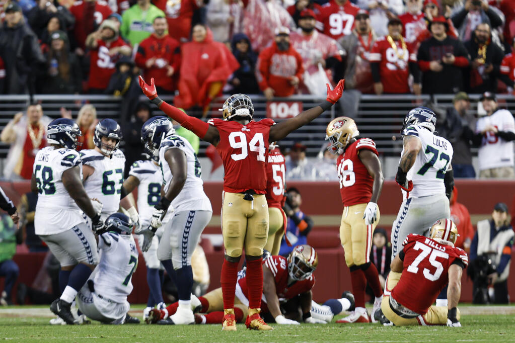 49ers defensive end Charles Omenihu celebrates during the second half of Saturday’s playoff game against the Seattle Seahawks in Santa Clara. (Jed Jacobsohn / ASSOCIATED PRESS)