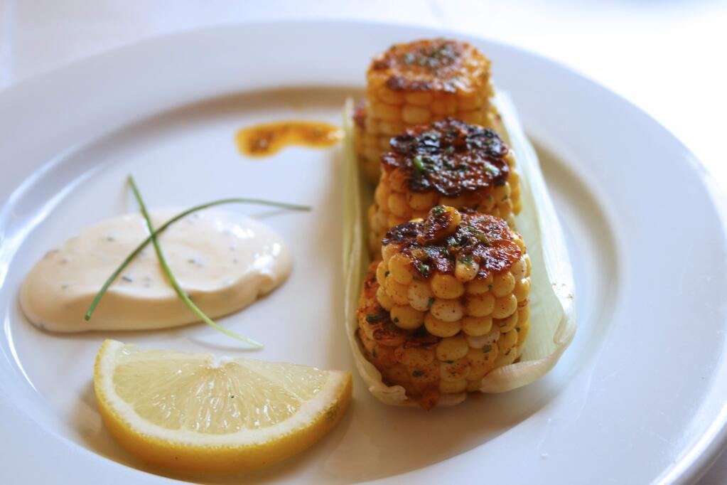 Elotitos, or oven-roasted corn with Jamaican jerk seasoning and chive crema at Guiso Latin Fusion. Photo: Heather Irwin.