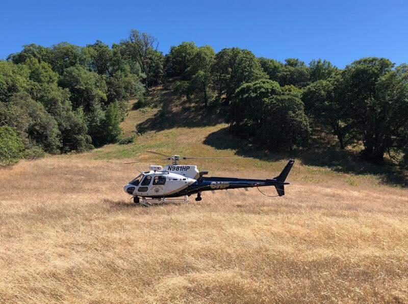 One of two helicopters in use by the Napa air operations unit lands in a field at Jack London State Historic Park, Sunday, July 8. (CHP)