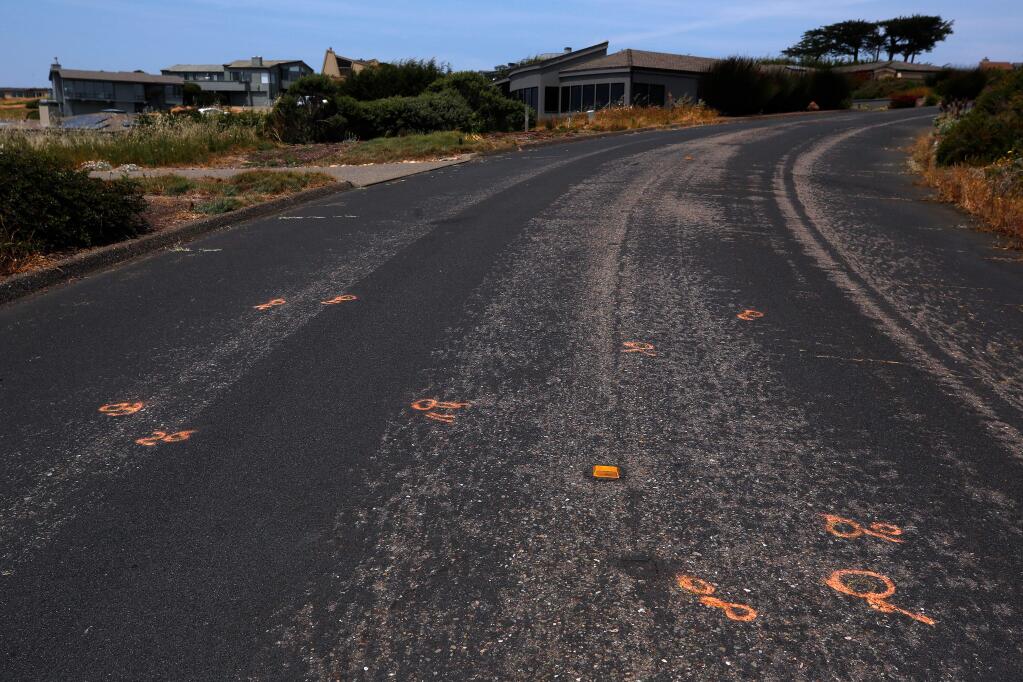 Evidence markers remain visible on Pelican Loop after an officer-involved shooting in Bodega Bay, California, on Saturday, July 6, 2019. Two days earlier, on July 4, a San Francisco man under the influence of drugs injured several people in the Bodega Bay neighborhood before being shot by a Sonoma County sheriff's deputy. (Alvin Jornada / The Press Democrat)