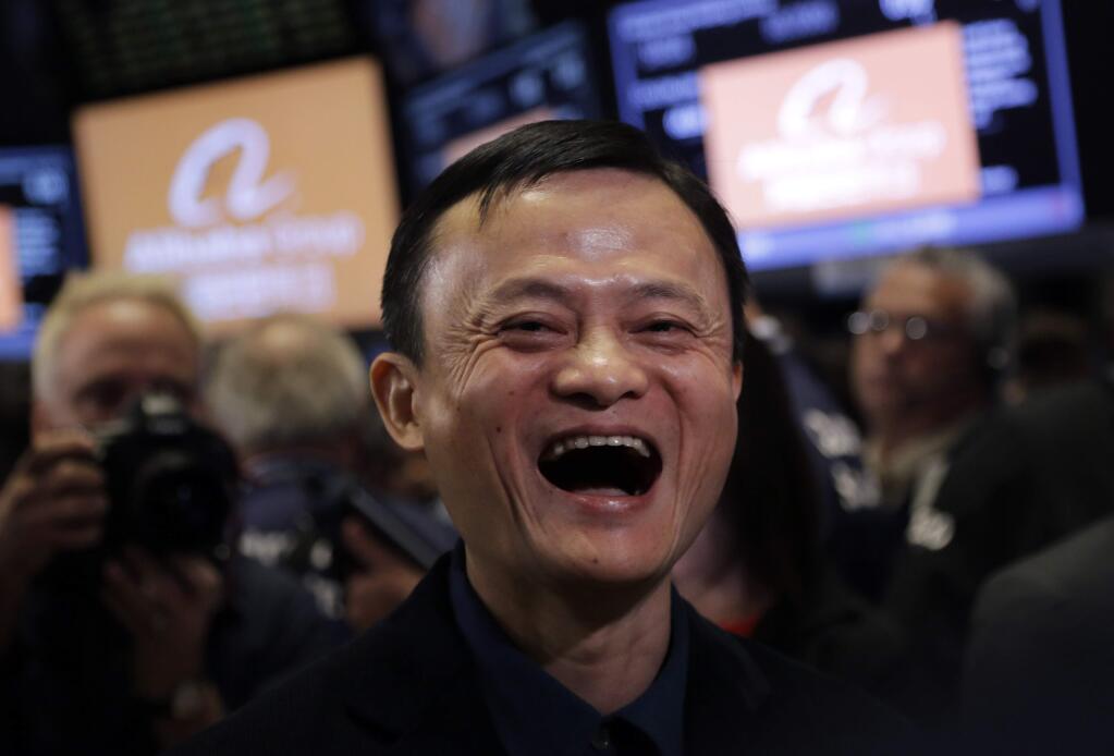Jack Ma, founder of Alibaba, smiles during the company's IPO at the New York Stock Exchange, Friday, Sept. 19, 2014 in New York. The stock is expected to start trading Friday under the ticker 'BABA.' The IPO values Alibaba at $167.62 billion, larger than the current market value of Amazon, Cisco, and eBay. (AP Photo/Mark Lennihan)