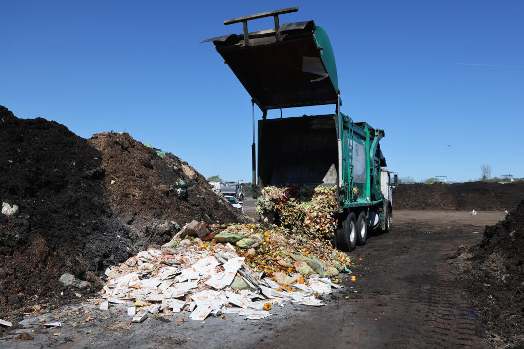 Organic materials from commercial compost bins are unloaded at the Recology waste facility in American Canyon, Calif., on Tuesday, March 22, 2022. Recology Sonoma Marin and the union representing its workers remain at a standstill on a new 5-year contract. (Beth Schlanker/The Press Democrat)