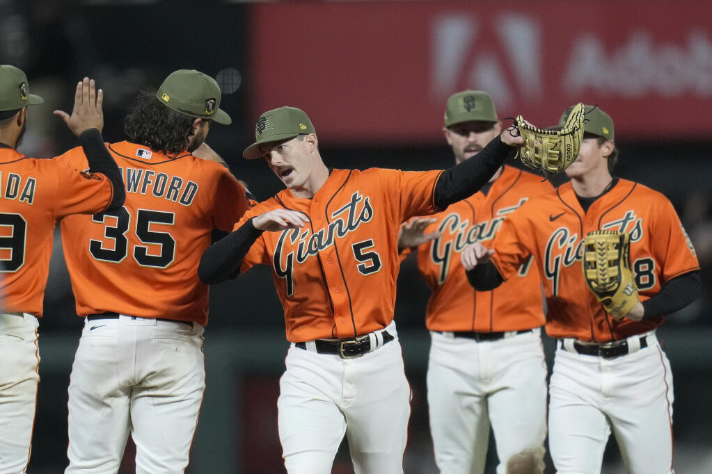 The Giants’ Mike Yastrzemski, center, celebrates with teammates after a 4-3 victory over the Miami Marlins in San Francisco, Friday, May 19, 2023. (Godofredo A. Vásquez / ASSOCIATED PRESS)