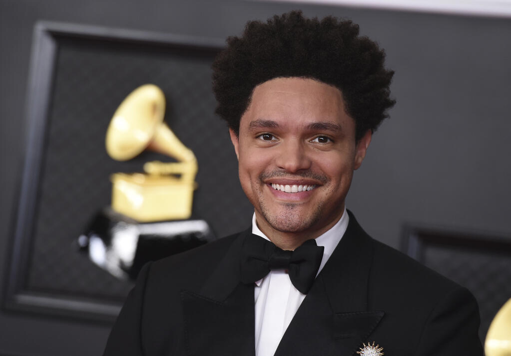 FILE - Trevor Noah appears at the 63rd annual Grammy Awards in Los Angeles on March 14, 2021. Noah is hosting the Grammy Awards for a third-straight year. (Photo by Jordan Strauss/Invision/AP, File)