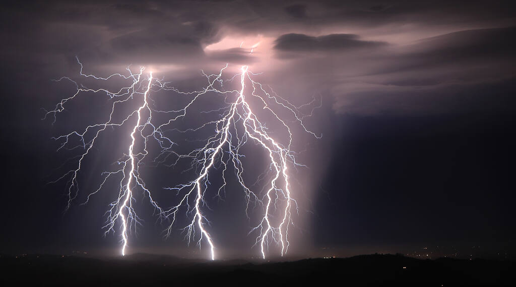 Step leaders branch out from five different cloud to ground lightning strikes, Sunday, August 16, 2020 as an early morning storm rips across the Santa Rosa plain near Healdsburg. (Kent Porter / The Press Democrat) 2020