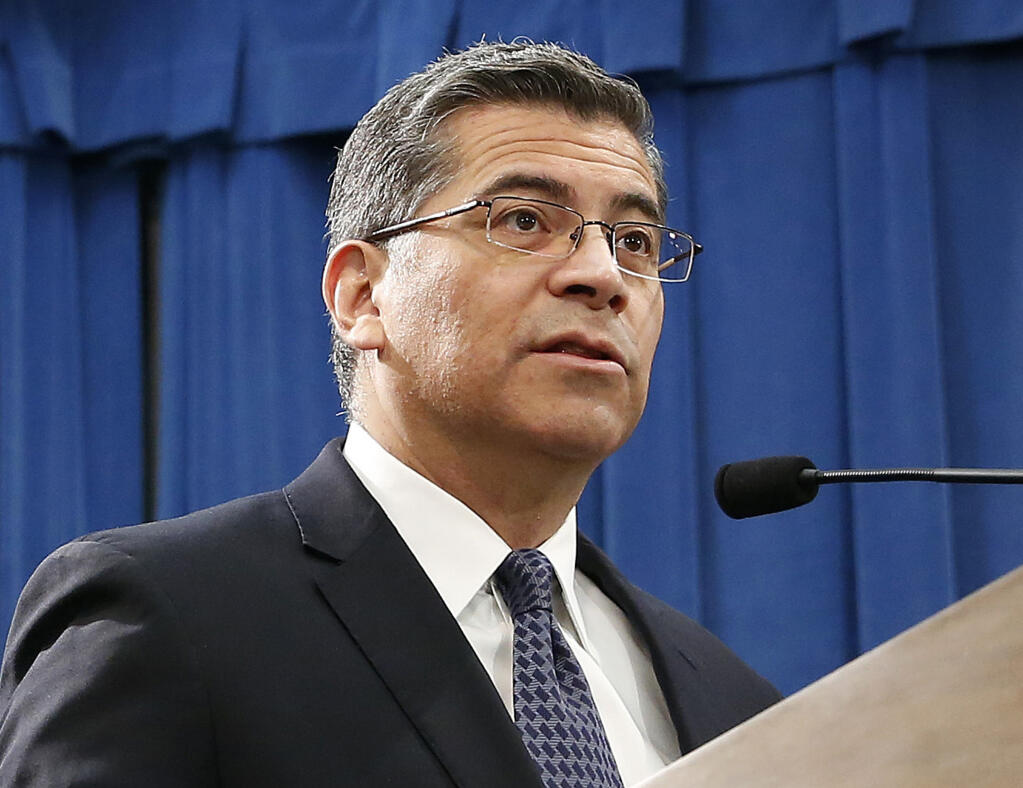 FILE - In this Feb. 15, 2019, file photo, California Attorney General Xavier Becerra speaks at a news conference in Sacramento, Calif.  (AP Photo/Rich Pedroncelli, File)