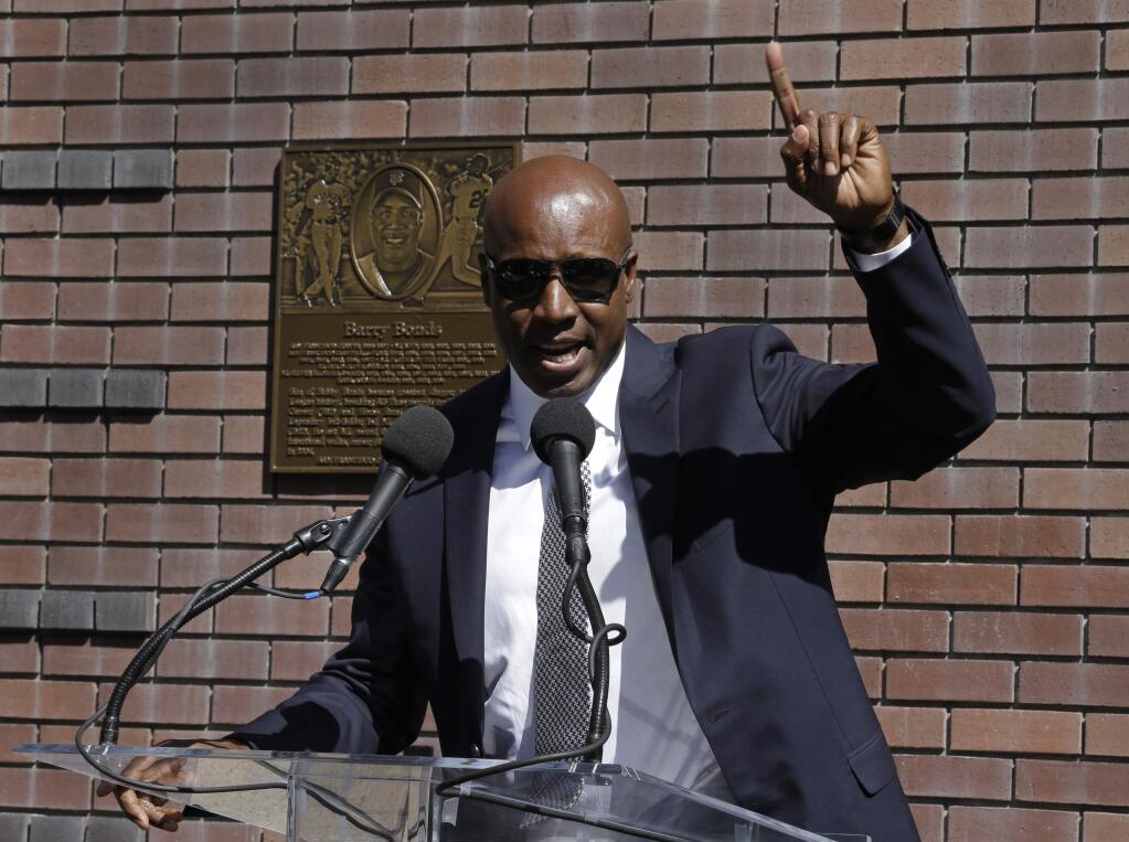 Former San Francisco Giants player Barry Bonds gestures while speaking at his Wall of Fame induction ceremony Saturday, July 8, 2017, in San Francisco. (AP Photo/Ben Margot)