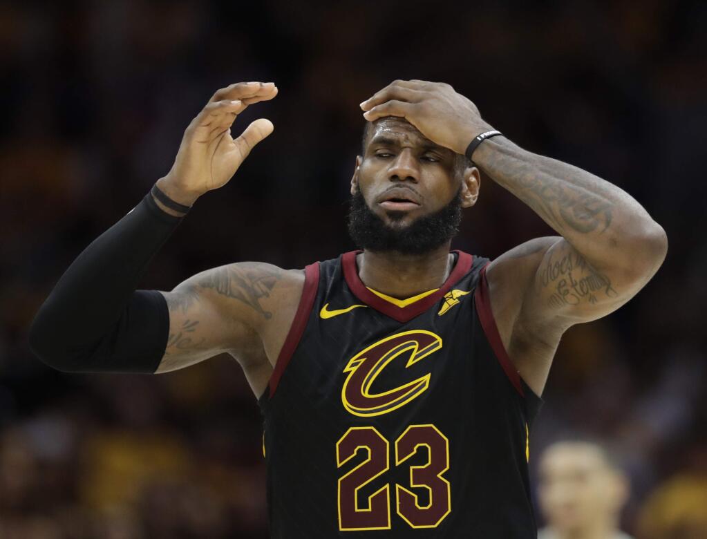 The Cleveland Cavaliers' LeBron James reacts in the second half of Game 3 of the NBA Eastern Conference final against the Boston Celtics, Saturday, May 19, 2018, in Cleveland. (AP Photo/Tony Dejak)