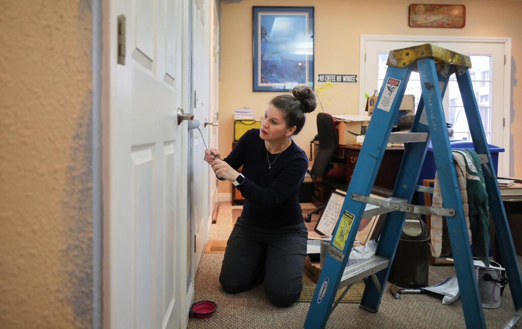 Robin Estes paints the office in her Santa Rosa home on Wednesday, May 13, 2020. Estes has used her time during the shelter in place to make improvements around her house.(Christopher Chung/ The Press Democrat)