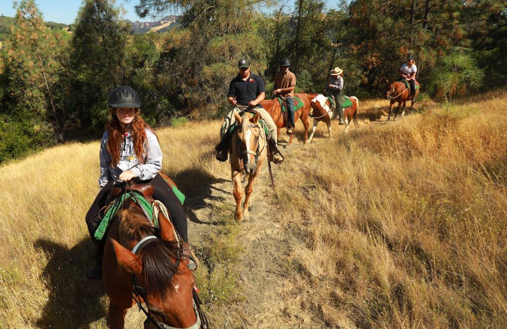 U.S. Army Corps Park Ranger Poppy Lozoff, 4th from the left, leads 'An Interpretive Ride With a Ranger' at Lake Sonoma on Thursday, July 27, 2017. (John Burgess/The Press Democrat)
