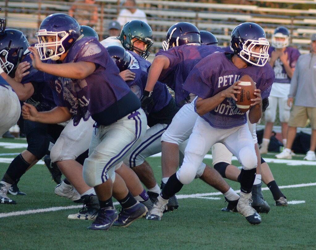 SUMNER FOWLER/FOR THE ARGUS-COURIERPetaluma will test its offensive line for real Friday night when the Trojans open their season against Montgomery on their borrowed home at Casa Grande.