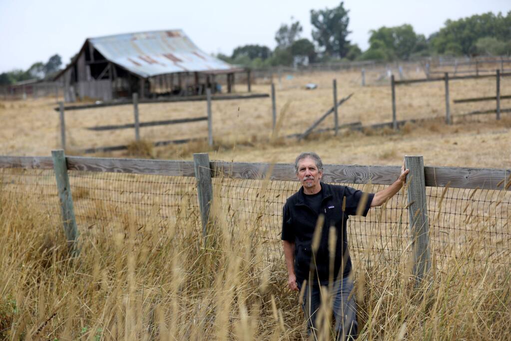 (FILE PHOTO) Walker Avenue resident Greg Eicher stands next to the proposed site of a compost facility, just north of the Laguna Wastewater Treatment Plant on Llano Road. Photo near Santa Rosa on Thursday, Sept. 5, 2019. (BETH SCHLANKER/ PD)