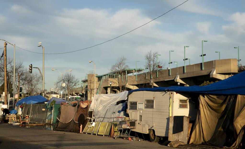 A tent encampment in West Oakland. Photo by Anne Wernikoff for CalMatters