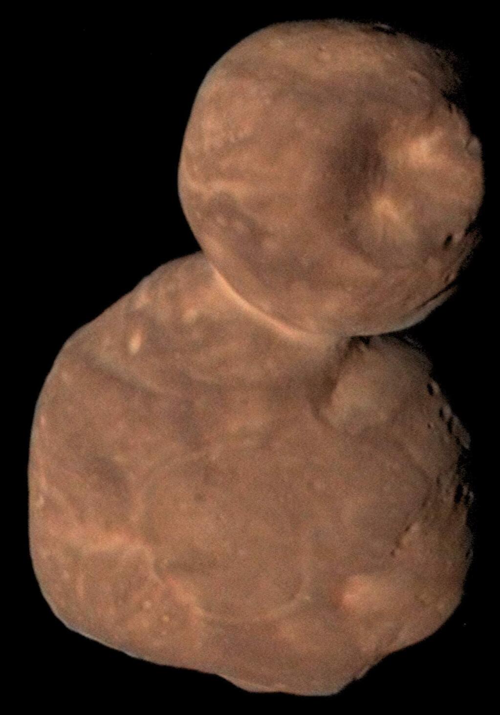 This Jan. 1, 2019 image from NASA shows Arrokoth, the farthest, most primitive object in the Solar System ever to be visited by a spacecraft. Astronomers reported Thursday, Feb. 13, 2020 that this pristine, primordial cosmic body photographed by the New Horizons probe is relatively smooth with far fewer craters than expected. It's also entirely ultrared, or highly reflective, which is commonplace in the faraway Twilight Zone of our solar system known as the the Kuiper Belt. (NASA/Johns Hopkins University Applied Physics Laboratory/Southwest Research Institute/Roman Tkachenko via AP)