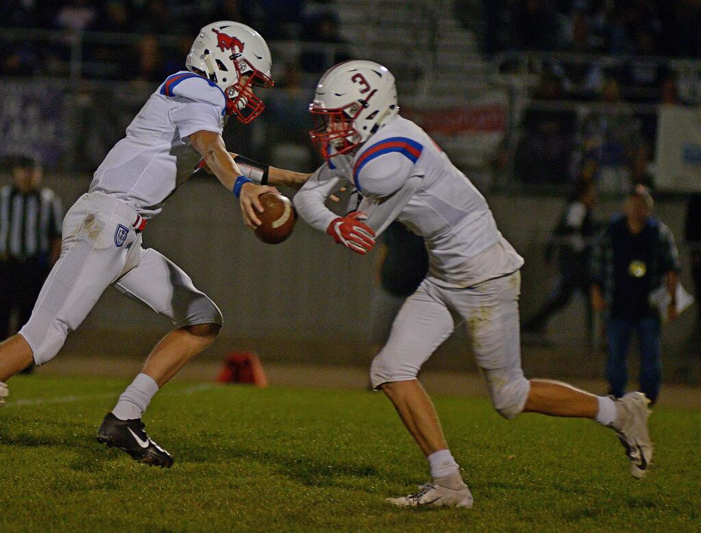 SUMNER FOWLER FOR THE ARGUS-COURIERA familiar sight for St. Vincent fans was quarterback Trent Free handing off to Daniel Burleson. The seniors helped the Mustangs reach the NCS playoffs.