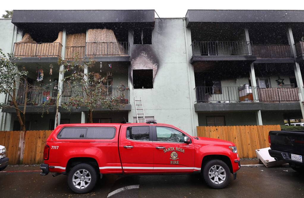 A two-alarm fire Thursday night burned a building at Nueva Vista Apartments, on West Steel Lane in Santa Rosa, displacing residents from 64 units.(Christopher Chung/ The Press Democrat)