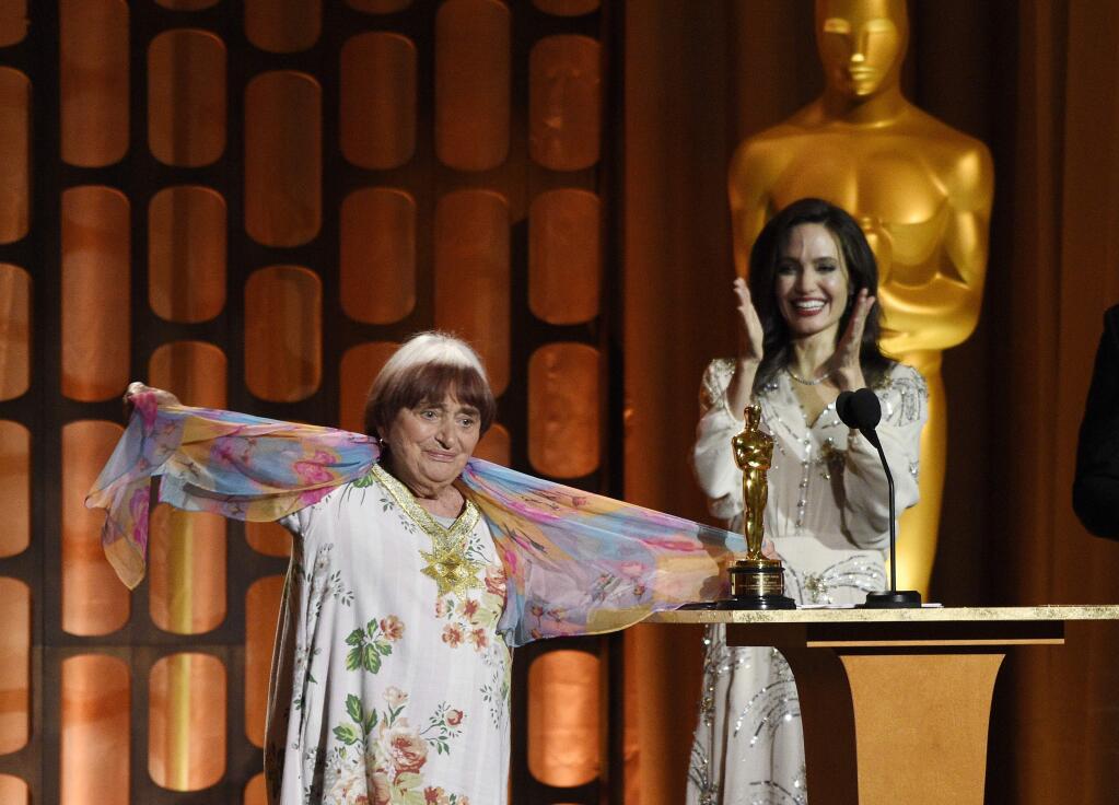French director Agnes Varda, left, celebrates onstage with her honorary Oscar as presenter Angelina Jolie looks on at the 2017 Governors Awards at The Ray Dolby Ballroom on Saturday, Nov. 11, 2017, in Los Angeles. (Photo by Chris Pizzello/Invision/AP)