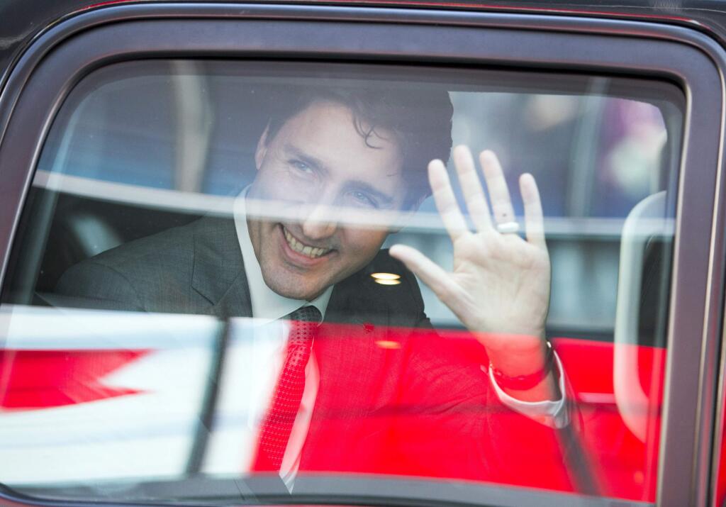 Prime Minister Justin Trudeau waves as he leaves the offices of Salesforce Thursday, Feb. 8, 2018 in San Francisco. (Ryan Remiorz/The Canadian Press via AP)