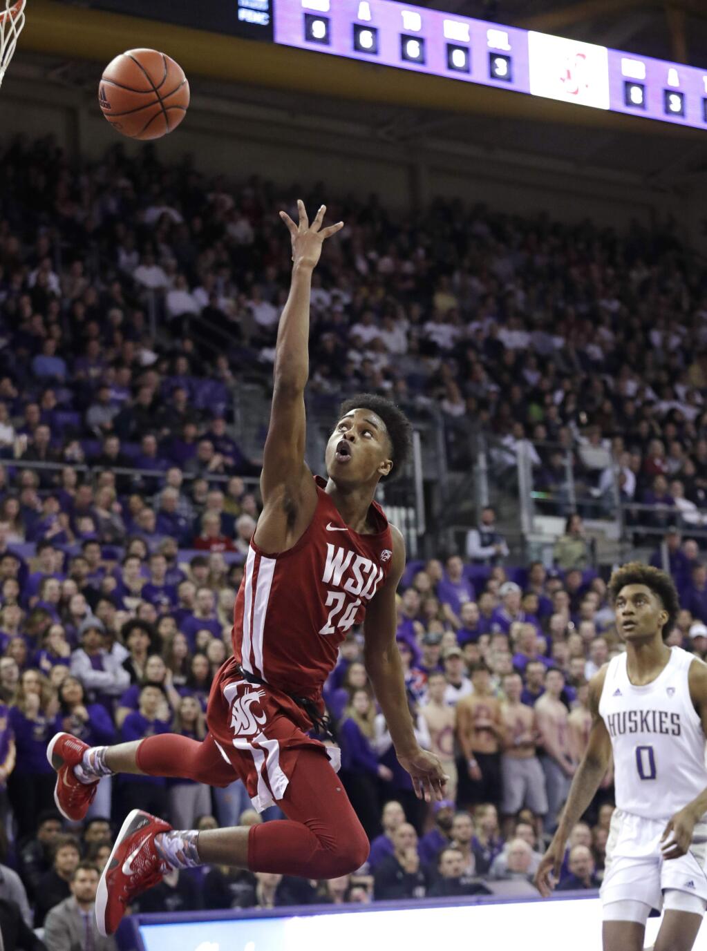 Washington State's Noah Williams (24) shoots against Washington during the first half of an NCAA college basketball game Friday, Feb. 28, 2020, in Seattle. (AP Photo/Elaine Thompson)