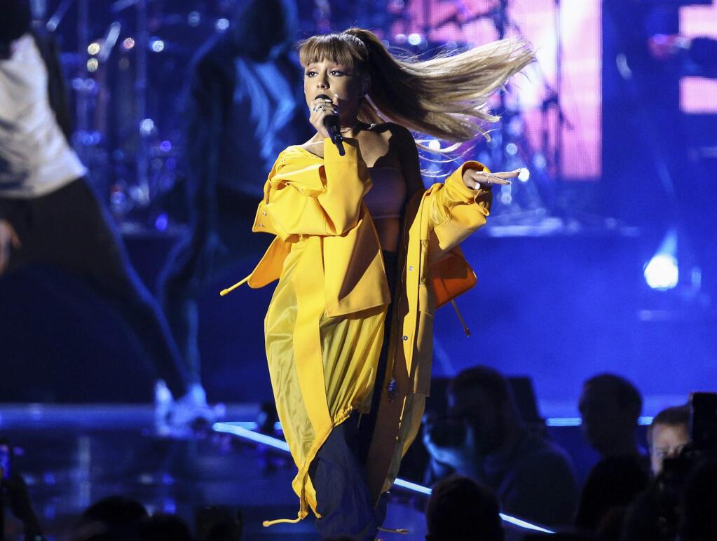 FILE - In this Sept. 24, 2016 file photo, Ariana Grande performs at the 2016 iHeartRadio Music Festival in Las Vegas. Police say there are 'a number of fatalities' after reports of an explosion at an Ariana Grande concert at Manchester Arena in northern England on Monday, May 22, 2017.. (Photo by John Salangsang/Invision/AP, File)