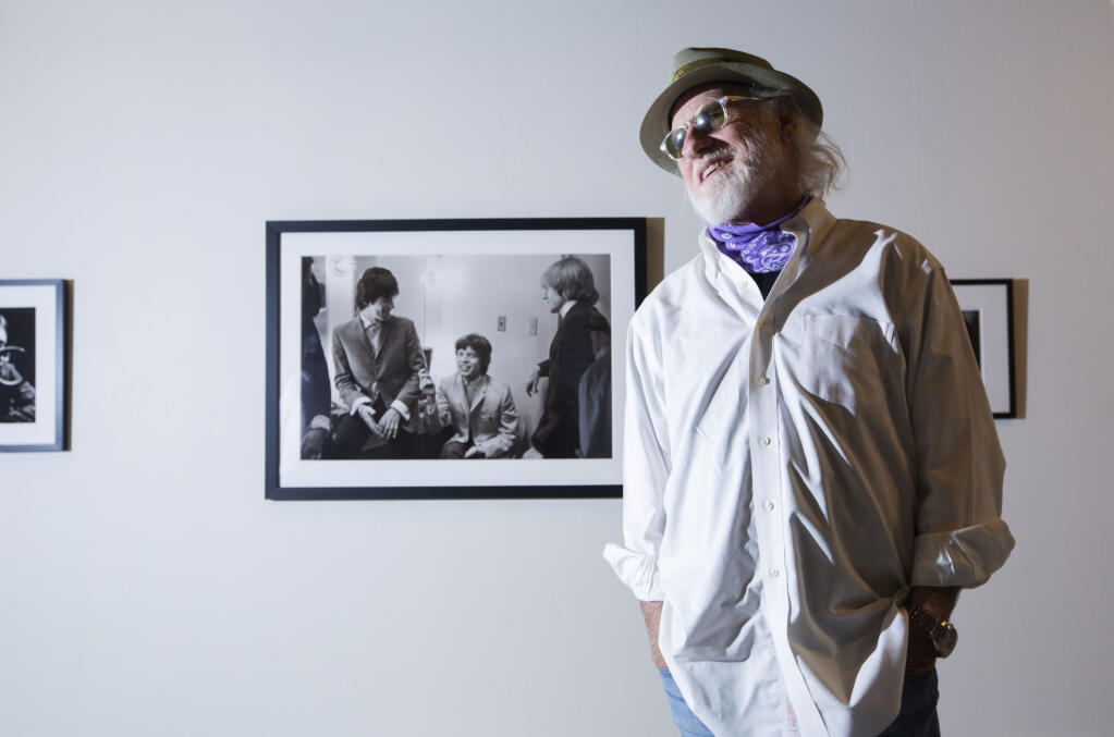 Joel Selvin, author and former San Francisco Chronicle music critic, curated the exhibit ’California Rocks! Photographers Who Made The Scene, 1960-1980.’ Behind him is a mid-1960s shot of Rolling Stones Keith Richards, Mick Jagger and Brian Jones. (Photo by Robbi Pengelly/Index-Tribune)