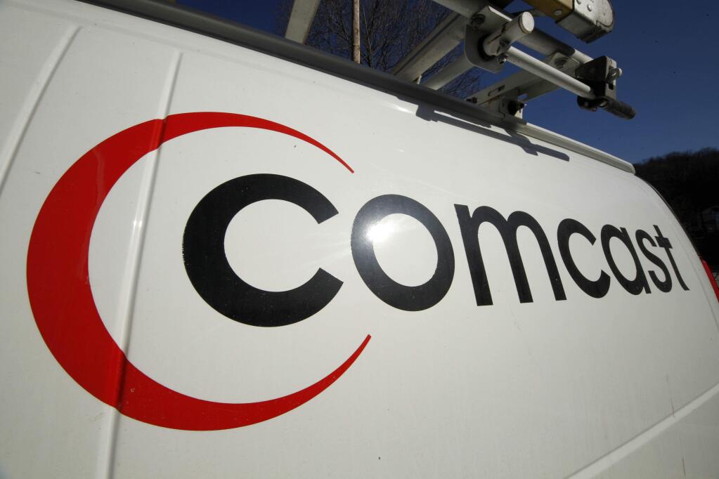 FILE - This Feb. 11, 2011 file photo shows the Comcast logo on one of the company's vehicles, in Pittsburgh. Wall Street appears increasingly convinced Comcasts $45.2 billion purchase of Time Warner Cable is dead. telling indicator is the gap between the value Comcasts all-stock bid assigned to each Time Warner Cable share and Time Warner Cable stocks current price. That was at its widest point yet Thursday, April 23, 2015, a signal that investors are giving just 20 to 30 percent odds that the deal will go through, said Nomura analyst Adam Ilkowitz. (AP Photo/Gene J. Puskar, File)