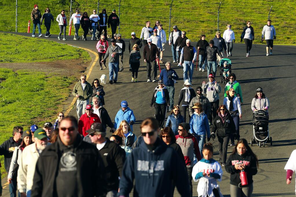Walkers, bikers and runners took the the racetrack at Sonoma Raceway on Saturday for the John's March, No Stomach for Cancer walk for stomach cancer awareness and research. (photo by John Burgess/The Press Democrat)