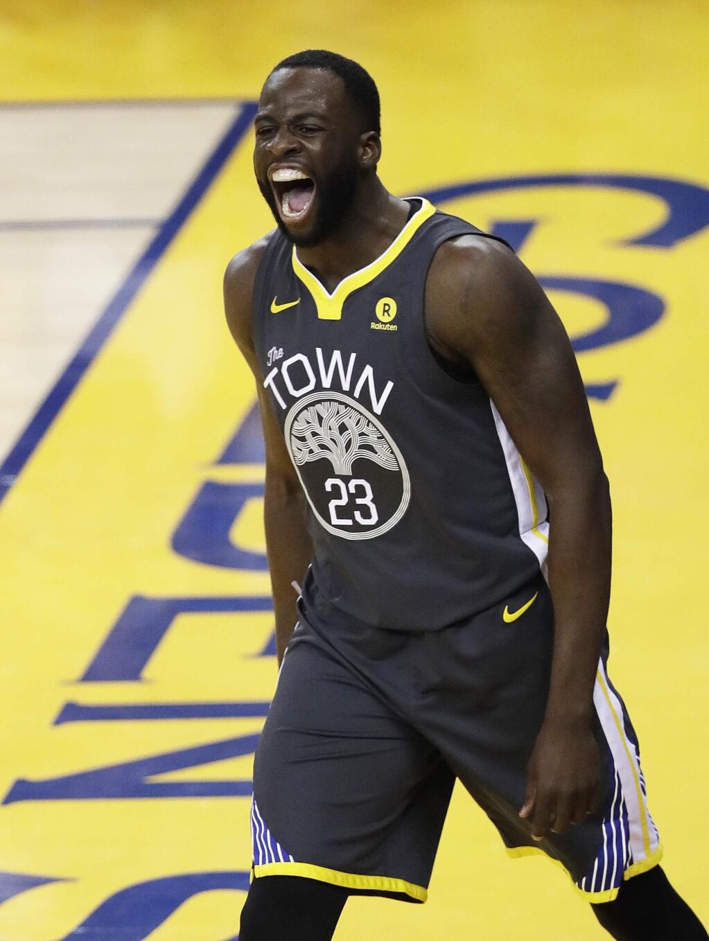 Golden State Warriors forward Draymond Green celebrates after scoring against the Cleveland Cavaliers during the first half of Game 2 of the NBA Finals in Oakland, Sunday, June 3, 2018. (AP Photo/Marcio Jose Sanchez)