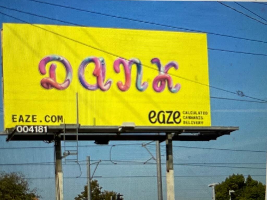 This Sacramento billboard spells out a cannabis product name with gummies. Photo by Jim Keddy
