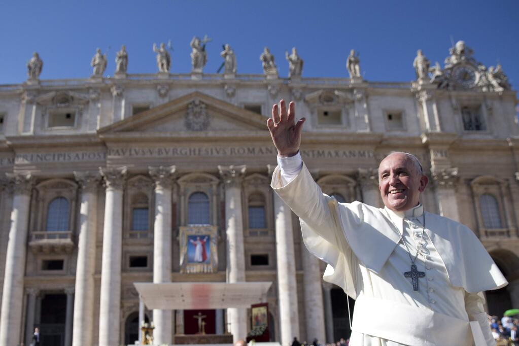 Pope Francis waves as he leaves after he celebrated the beatification ceremony of Pope Paul VI, and a mass for the closing of of a two-week synod on family issues, in Saint Peter's Square at the Vatican, Sunday, Oct. 19, 2014. (AP Photo/Andrew Medichini)