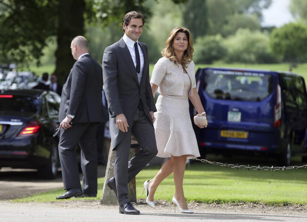 Swiss tennis player Roger Federer and his wife Mirka arrive for the wedding of Pippa Middleton and James Matthews at St Mark's Church in Englefield, England, Saturday, May 20, 2017. Middleton, the younger sister of Kate, Duchess of Cambridge is to marry hedge fund manager James Matthews in a ceremony Saturday where her niece and nephew Prince George and Princess Charlotte are in the wedding party, along with sister Kate and princes Harry and William. (AP Photo/Tim Ireland)