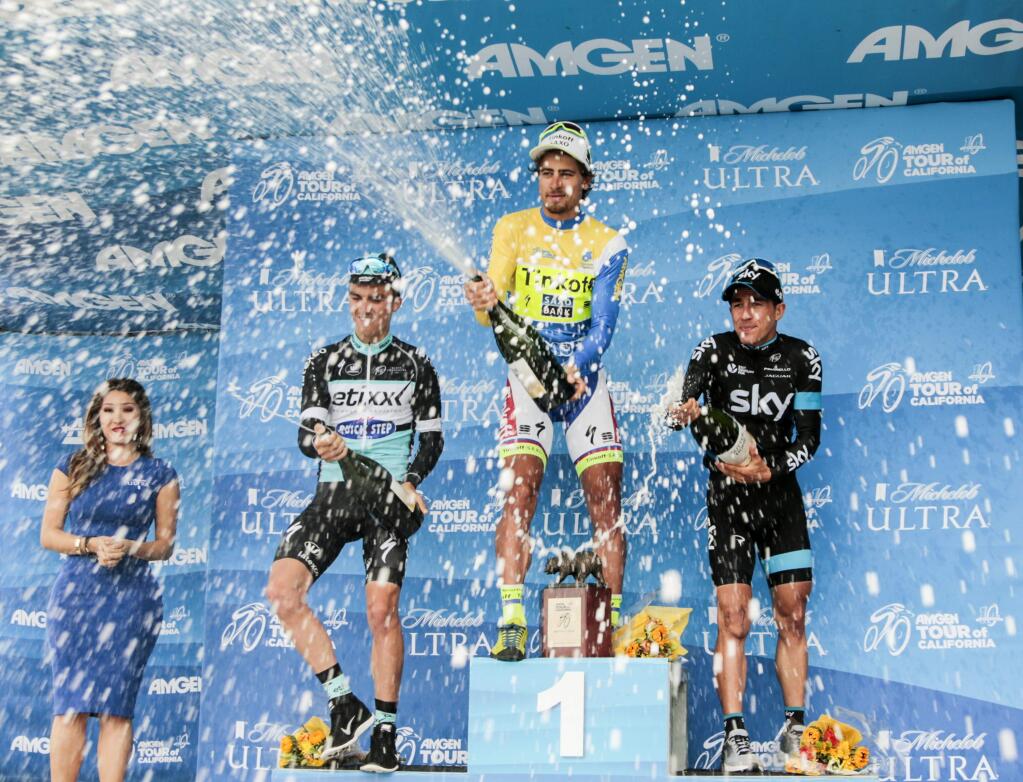 Peter Sagan of Slovakia riding for Tinkoff-Saxo, middle, celebrates his victory of the final overall standings along with second place finisher Julian Alaphillippe of France riding for Etixx-QuickStep, left, and third place finisher Sergio Henao of Columbia riding for Team Sky, right, at the end of the 2015 Amgen Tour of California from Los Angeles to Pasadena at the Rose Bowl on Sunday, May 17, 2015. (AP Photo/Damian Dovarganes)