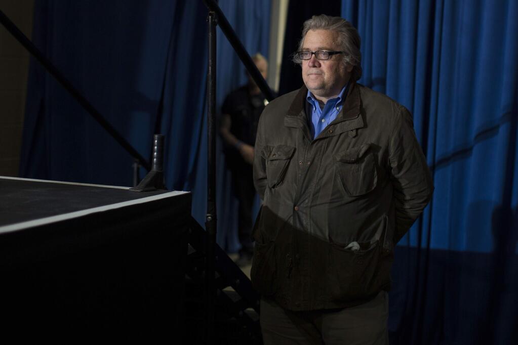 Stephen Bannon, campaign CEO for Republican presidential candidate, Donald Trump, looks on as Trump speaks during a campaign rally, Saturday, Nov. 5, 2016, in Denver. (AP Photo/ Evan Vucci)