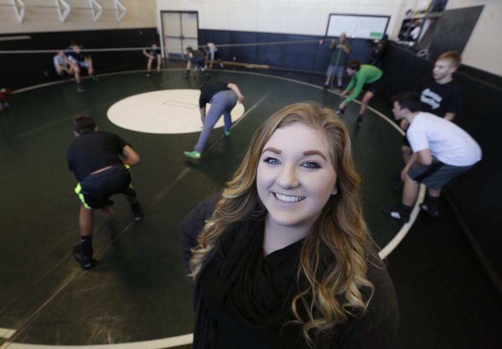 Sonoma Valley High School student Kayla Winslow, 17, is doing her senior project in honor of her late father and longtime wrestling coach Roger 'Deets' Winslow. Photo taken during wrestling practice at Sonoma Valley High School on Thursday, December 22, 2016 in Sonoma, California . (BETH SCHLANKER/The Press Democrat)
