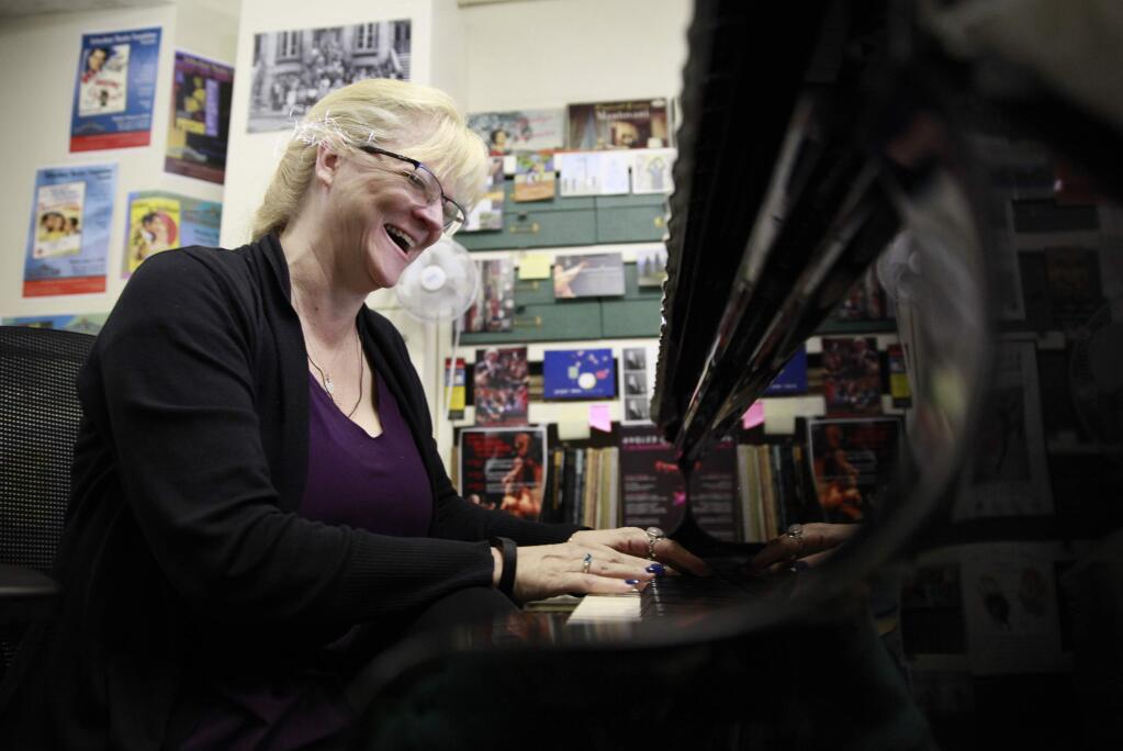 Cynthia Tarr laughs while giving voice lessons at the Sonoma Community Center on Wednesday, November 26, 2014 in Sonoma, California . (BETH SCHLANKER/ The Press Democrat)