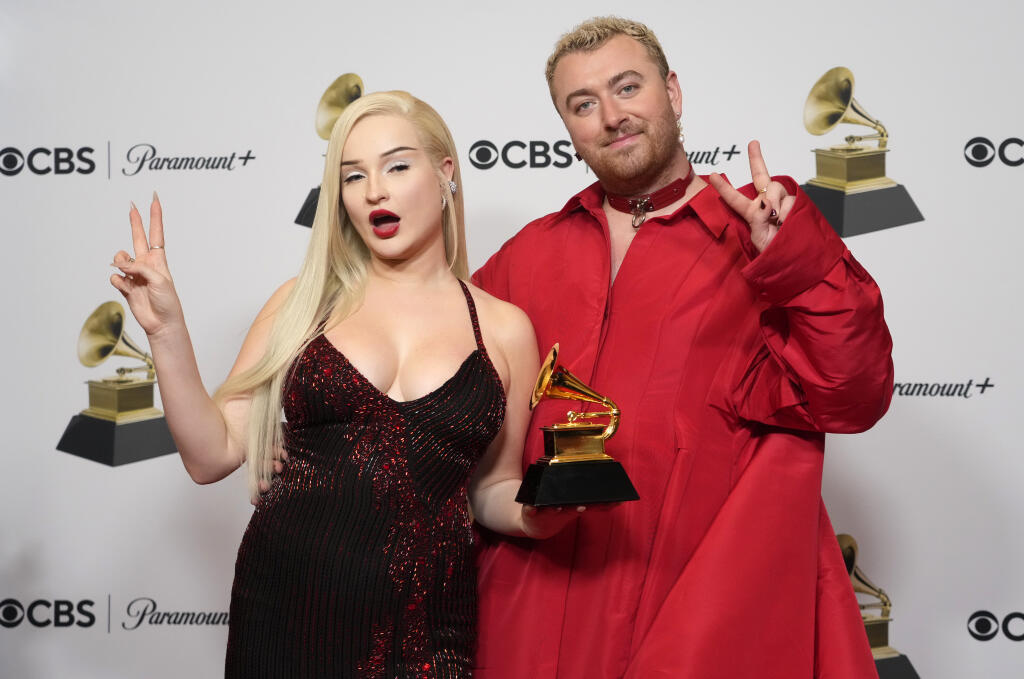 Kim Petras, left, and Sam Smith, winners of the award for Best Pop Duo/Group Performance for "Unholy," pose in the press room at the 65th annual Grammy Awards on Sunday, Feb. 5, 2023, in Los Angeles. (AP Photo/Jae C. Hong)