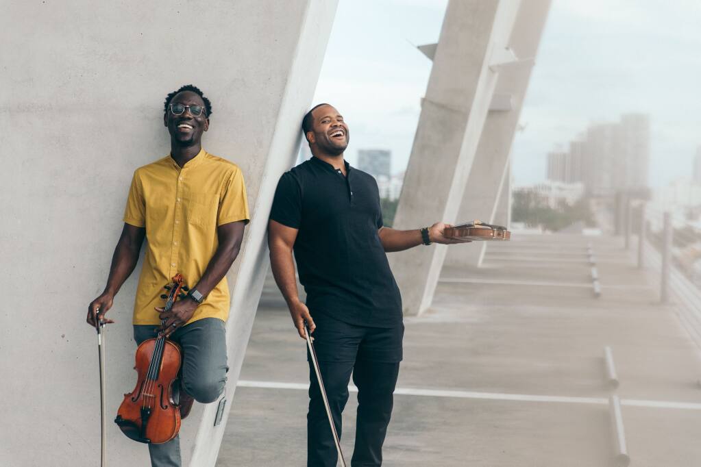 Wil B., left, and Kev Marcus of the Black Violin duo will perform Monday, March 14, at Santa Rosa’s Luther Burbank Center for the Arts. (Mark Clennon, 2019)