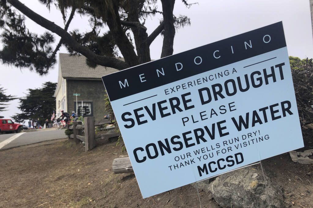 Signs alert visitors to the severe drought in Mendocino, Calif., on Wednesday, Aug. 4, 2021.  (AP Photo/Haven Daley)