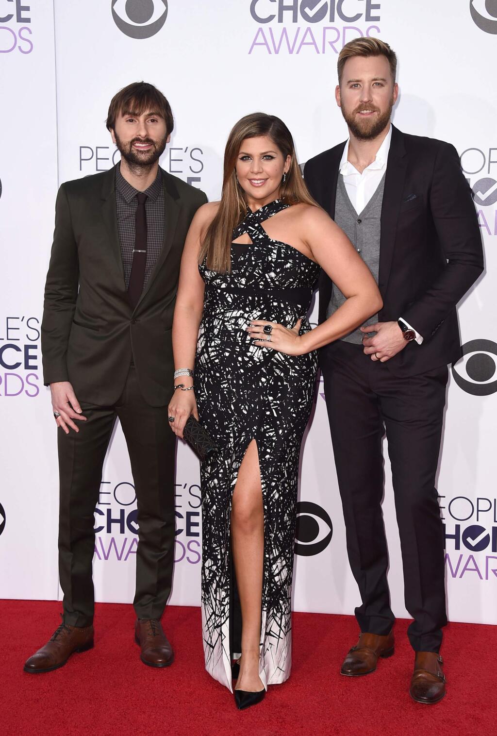 Dave Haywood, from left, Hillary Scott and Charles Kelley of Lady Antebellum arrive at the People's Choice Awards at the Nokia Theatre on Wednesday, Jan. 7, 2015, in Los Angeles. (Photo by Jordan Strauss/Invision/AP)
