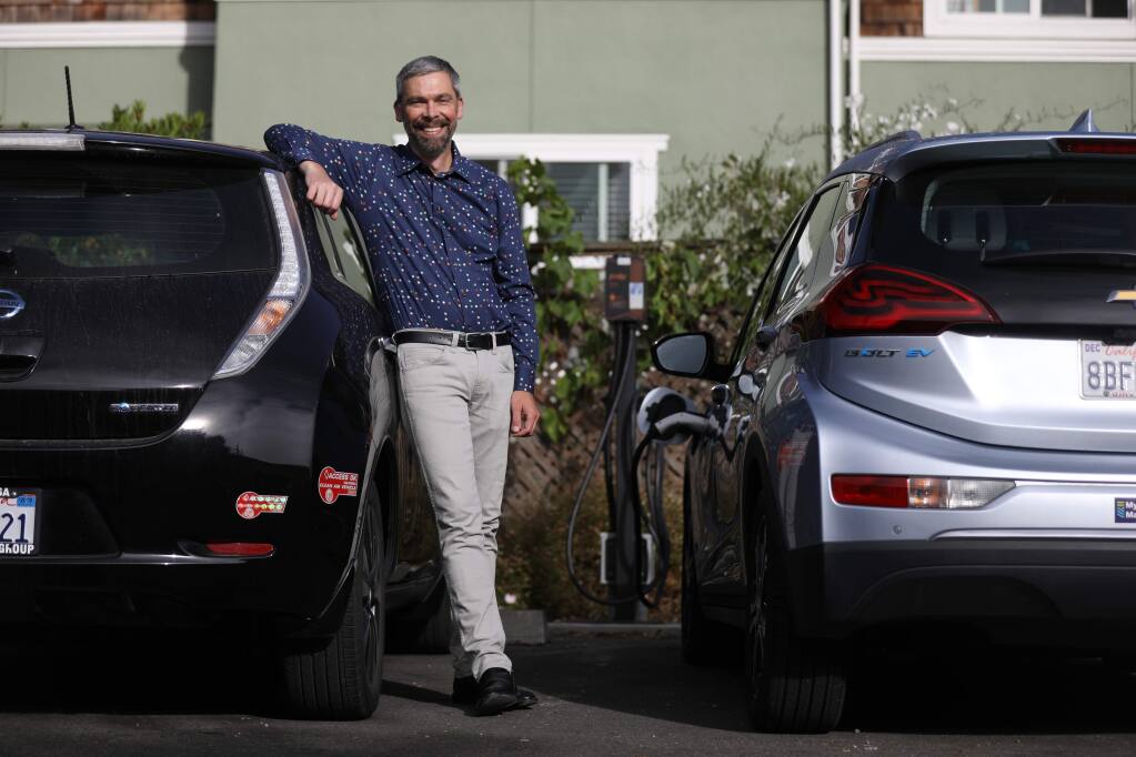 Geof Syphers the CEO of Sonoma Clean Power stands near a charging stations for electric vehicles at Frogsong Cohousing in Cotati, California on Friday, August 2, 2019. (BETH SCHLANKER/The Press Democrat)