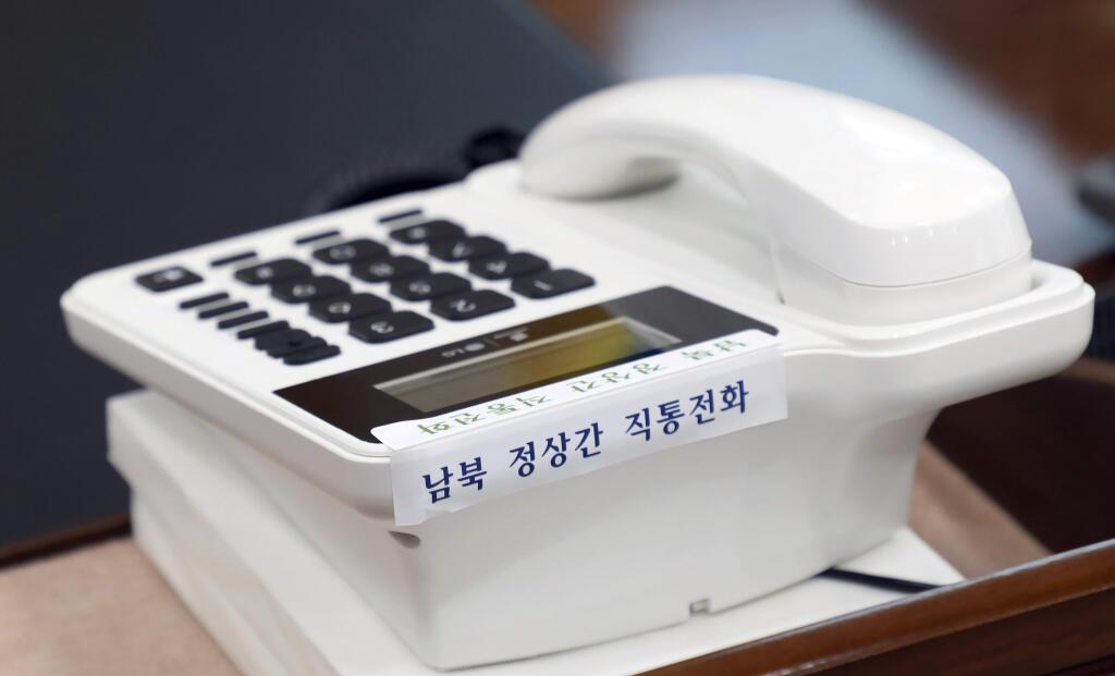 This photo provided by South Korea Presidential Blue House via Yonhap News Agency, shows a telephone hotline between South Korea and North Korea at the presidential Blue House in Seoul, South Korea, Friday, April 20, 2018. North and South Korea installed a telephone hotline between their leaders Friday as they prepare for a rare summit next week aimed at resolving the nuclear standoff with Pyongyang. The Koreans read ' Direct hotline between South and North.'(South Korea Presidential Blue House/Yonhap via AP)